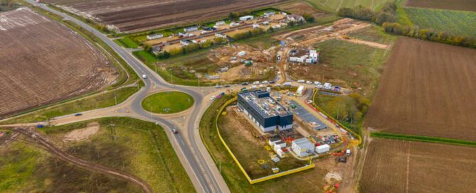 Field with building site
